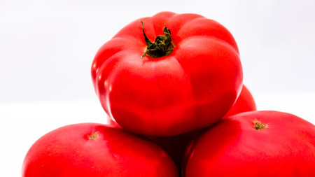 Fresh and tasty ripe red tomatoes isolatedの写真素材