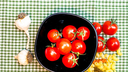 Beautiful tasty Italian pasta, tomatoes, onions and garlic for cooking pastaの写真素材