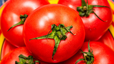 Close up of ripe red tomato, tomatoes background.の写真素材