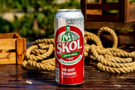 SKOL beer can - condensation water droplets, outdoors backgroundのeditorial素材