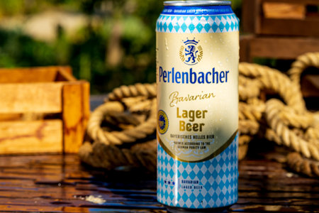 Perlenbacher beer can - condensation water droplets, outdoors background