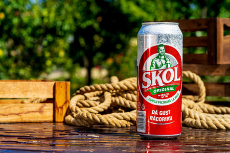 SKOL beer can - condensation water droplets, outdoors backgroundのeditorial素材