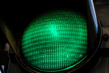 Part of a traffic light, with green light turned onの写真素材