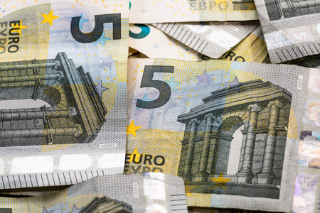 5 EURO banknotes. EUR money background representing savings, income, or investment