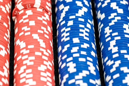 Stacks of poker chips with money on black background, US Dollar currencyの写真素材