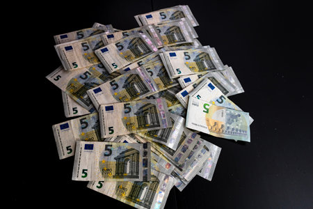 5 EURO banknotes. EUR money background representing savings, income, or investmentの写真素材