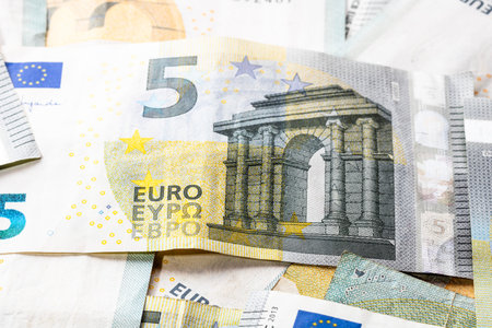 5 EURO banknotes. EUR money background representing savings, income, or investment