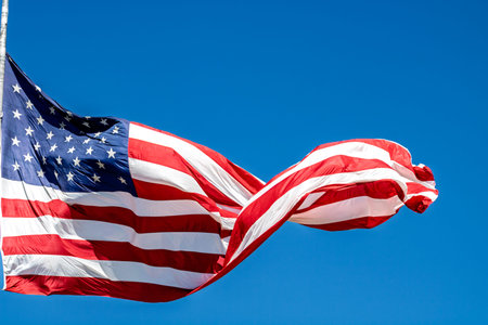 American flag waving in the wind. USA flag for Memorial Day or 4th of Julyの写真素材