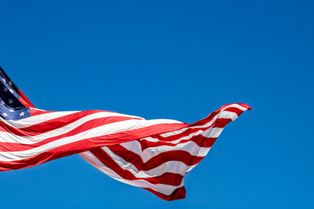 American flag waving in the wind. USA flag for Memorial Day or 4th of Julyの写真素材