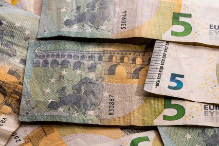 5 EURO banknotes. EUR money background representing savings, income, or investment