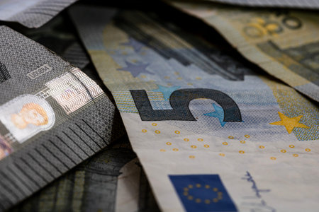 5 EURO banknotes. EUR money background representing savings, income, or investment