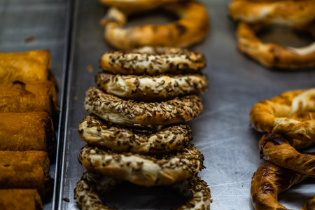 Freshly baked pastries placed in a street vendor displayの写真素材
