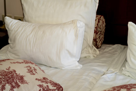 Soft, clean white pillow at luxury hotelの写真素材