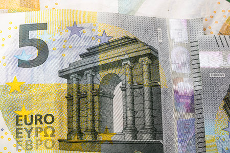 5 EURO banknotes. EUR money background representing savings, income, or investment