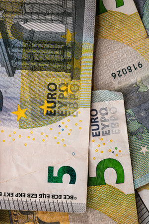 5 EURO banknotes. EUR money background representing savings, income, or investment