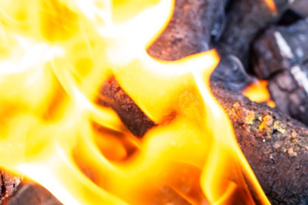 BBQ grill with burning wood and fire flames. Empty hot charcoal barbecue grill with bright flameの写真素材