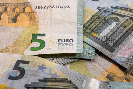 5 EURO banknotes. EUR money background representing savings, income, or investment