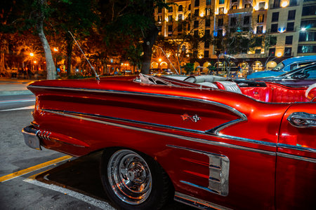 Vintage classic American car in Havana, Cuba. Typical Havana urban scene with colorful buildings and old carsの写真素材