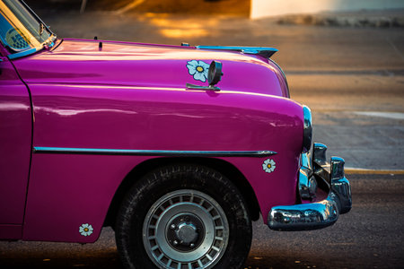 Vintage classic American car in Havana, Cuba. Typical Havana urban scene with colorful buildings and...
