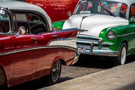 Vintage classic American car in Havana, Cuba. Typical Havana urban scene with colorful buildings and...