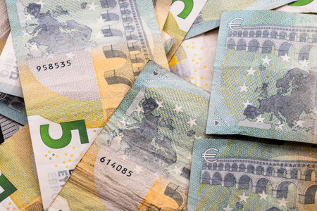 5 EURO banknotes. EUR money background representing savings, income, or investment