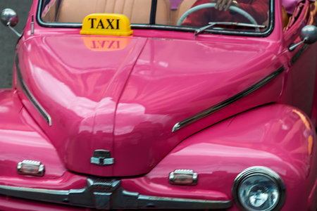 Vintage classic car in Havana, Cuba. Typical Havana urban scene with colorful buildings and old carsの写真素材