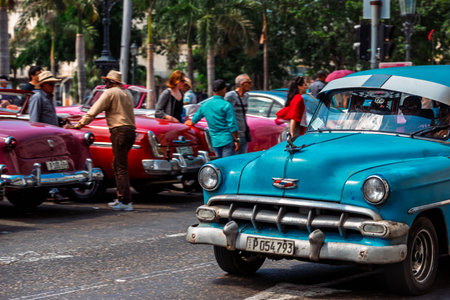 Vintage classic American car in Havana, Cuba. Typical Havana urban scene with colorful buildings and old carsの写真素材