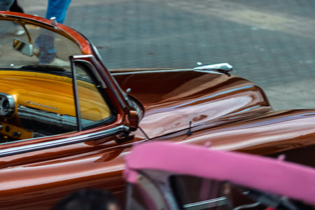 Vintage classic American car in Havana, Cuba. Typical Havana urban scene with colorful buildings and old carsの写真素材