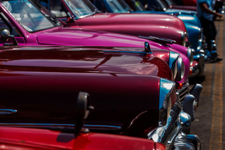 Vintage classic American car in Havana, Cuba. Typical Havana urban scene with colorful buildings and old carsの写真素材