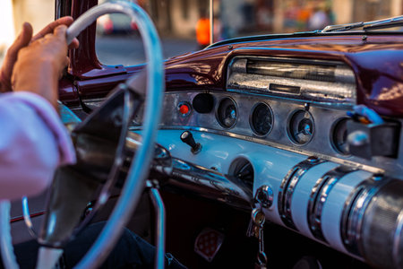 Vintage classic American car in Havana, Cuba. Typical Havana urban scene with colorful buildings and...