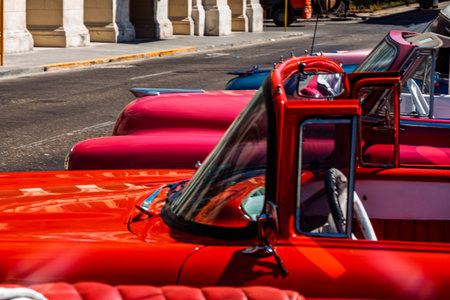 Vintage classic American car in Havana, Cuba. Typical Havana urban scene with colorful buildings and old carsの写真素材
