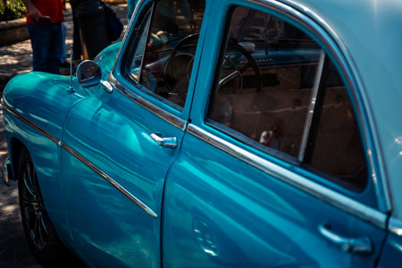 Vintage classic American car in Havana, Cuba. Typical Havana urban scene with colorful buildings and old carsの写真素材