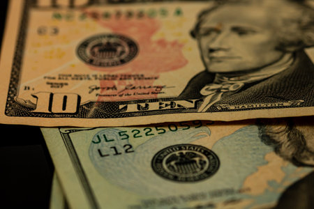 American Dollar banknotes representing economy and inflation in the United States. US dollar currency backgroundの写真素材
