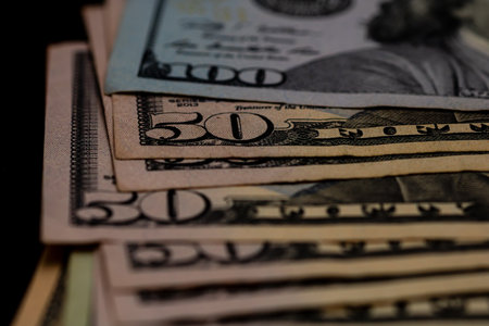 American Dollar banknotes representing economy and inflation in the United States. US dollar currency backgroundの写真素材