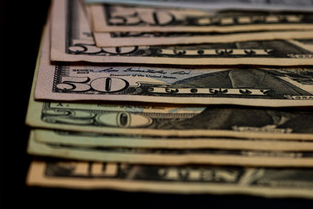 American Dollar banknotes representing economy and inflation in the United States. US dollar...