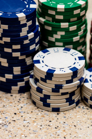 Detail of poker chips used for betting and wagering in a game of chanceの写真素材