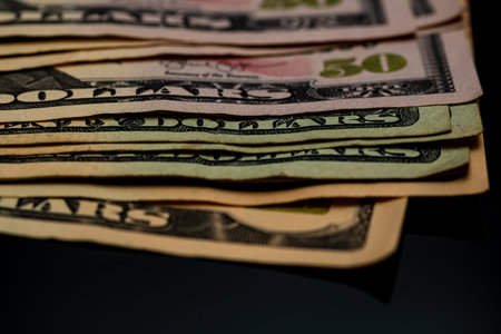 American Dollar banknotes representing economy and inflation in the United States. US dollar...