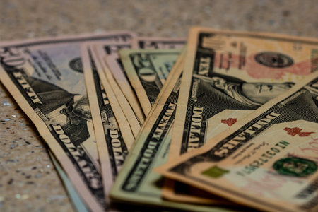 American Dollar banknotes representing economy and inflation in the United States. US dollar...