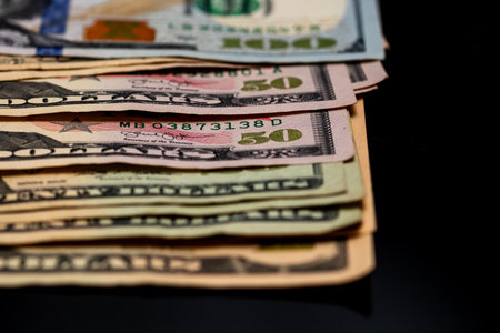 American Dollar banknotes representing economy and inflation in the United States. US dollar currency backgroundの写真素材