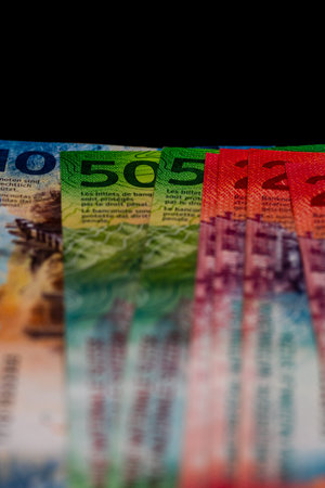 Close up detail of Swiss Franc banknotes representing economy and inflation in Switzerland