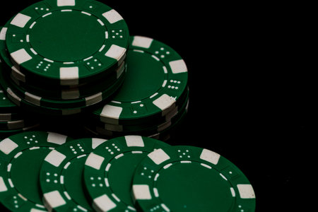 Detail of poker chips used for betting and wagering in a game of chanceの写真素材