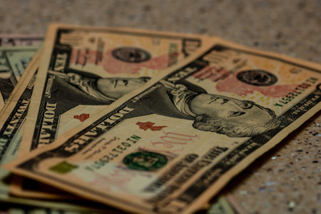 American Dollar banknotes representing economy and inflation in the United States. US dollar currency backgroundの写真素材