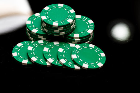 Detail of poker chips used for betting and wagering in a game of chance