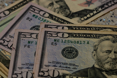 American Dollar banknotes representing economy and inflation in the United States. US dollar...