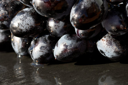 Fresh appetizing ripe grapes in a detailed macro shot showing skin texture and natural bloom for...