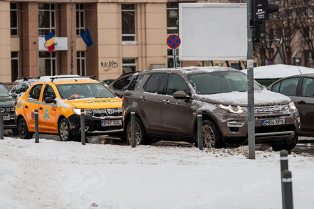 Morning traffic congestion with cars on snowy roads in Bucharest Romania during winterのeditorial素材