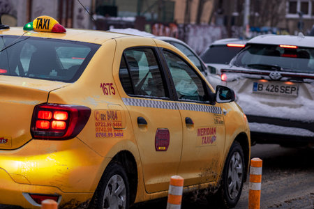 Morning traffic congestion with cars on snowy roads in Bucharest Romania during winterのeditorial素材