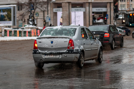 Morning traffic congestion with cars on snowy roads in Bucharest Romania during winterのeditorial素材