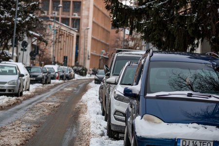 Morning traffic congestion with cars on snowy roads in Bucharest Romania during winterのeditorial素材