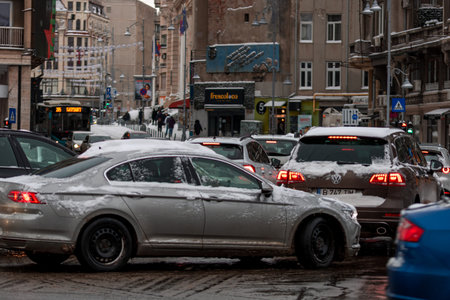 Morning traffic congestion with cars on snowy roads in Bucharest Romania during winter